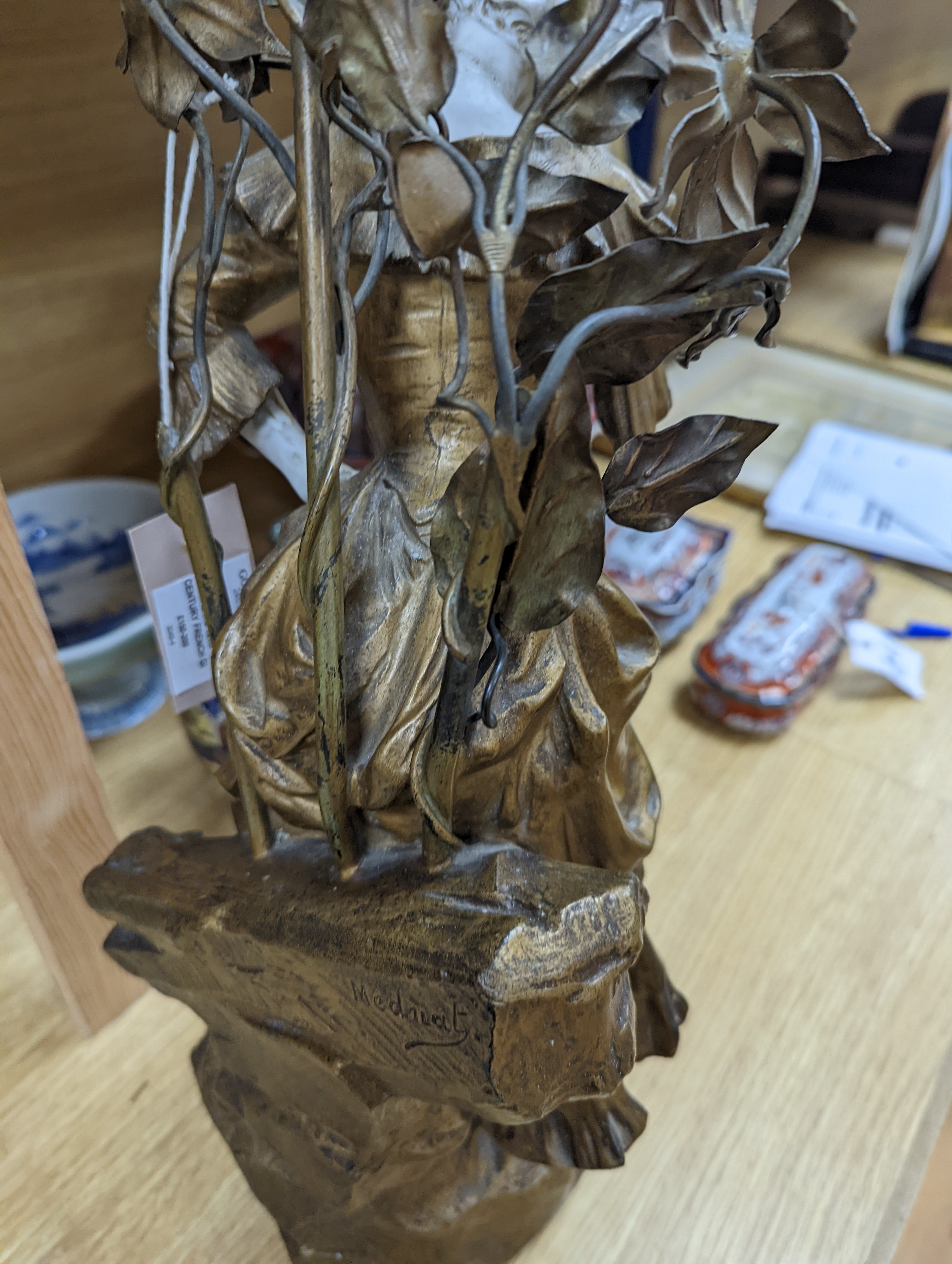 A late 19th Century French gilt spelter and bisque porcelain figure after Mednat 54cm